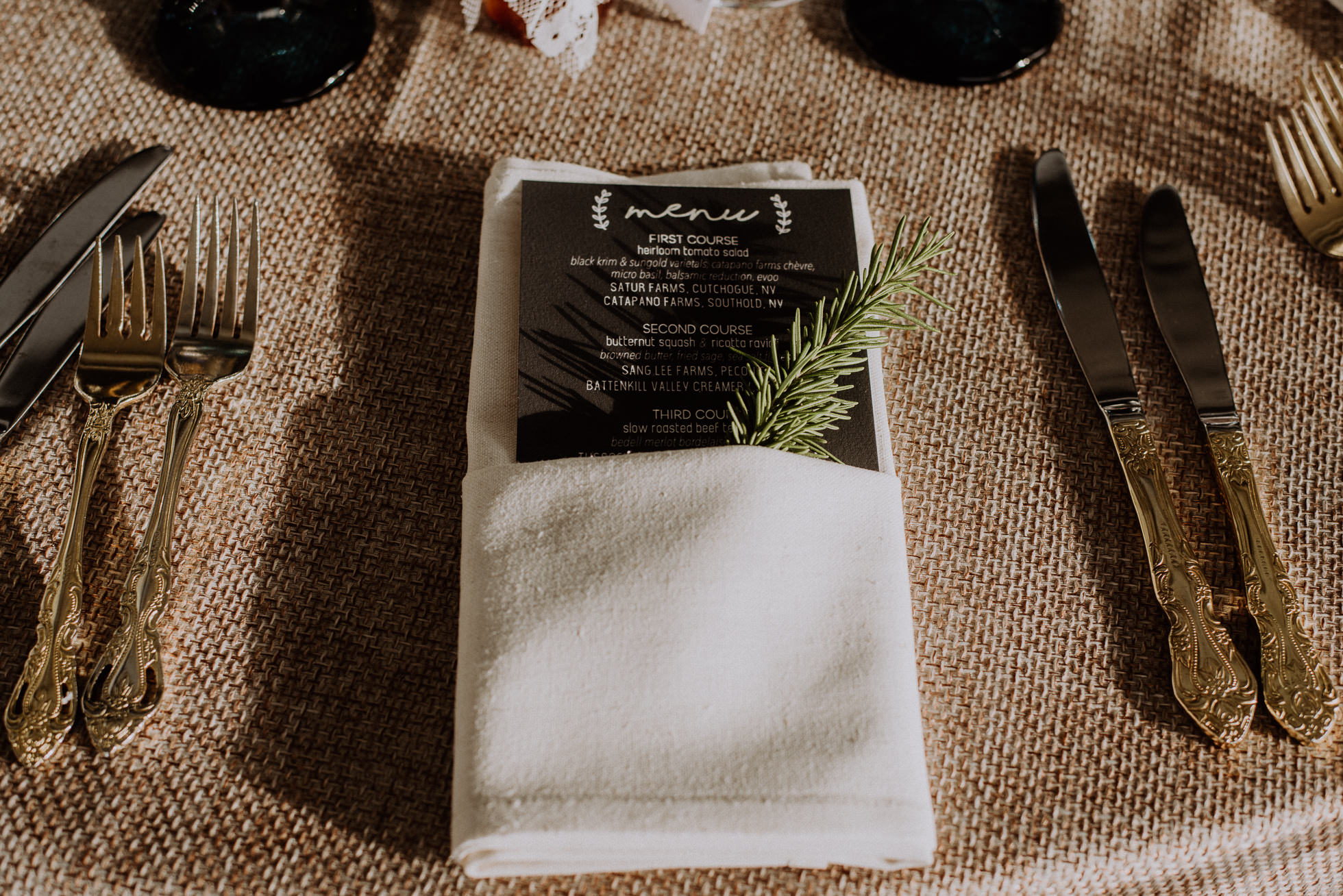 wedding table setting rosemary sprig